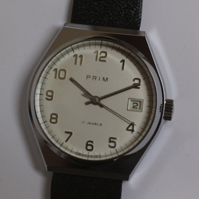 pánské Prim 68, nenošené, pásek Saturn