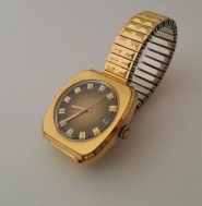 Prim zlacené, hnědý ciferník na dobovém kovovém řemínku