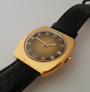 Prim zlacené hnědý ciferník  hranaté na koženém řemínku