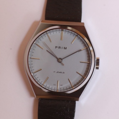 pánské Prim 66, nenošené, pásek Saturn