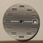 Šedý číselník Prim