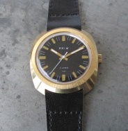 Prim Hulk - černý číselník - zlaté indexy a ručky - varianta co není v knihách