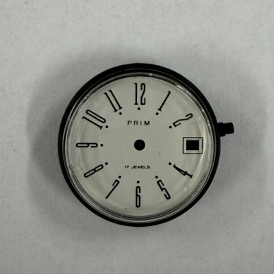 N.O.S. kapsulka s ciferníkom