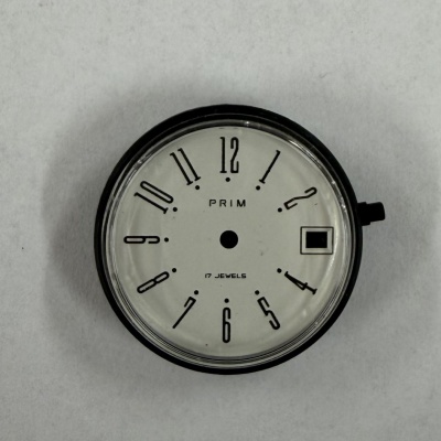 N.O.S. kapsulka s ciferníkom